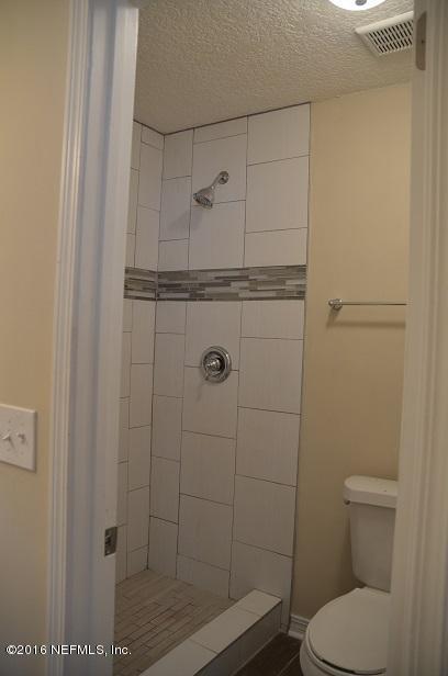 10982 Reading Road Jacksonville, FL 32257 - Photo 20 of 27 a bathroom with a toilet and a shower
