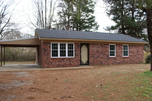a house with trees in the background