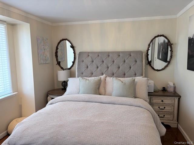 78-18 65th Street Queens, NY 11385 - Photo 11 of 25 a bed room with a bed mirror and a window