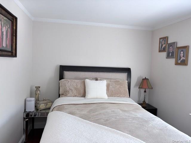 78-18 65th Street Queens, NY 11385 - Photo 15 of 25 a bedroom with a bed and window