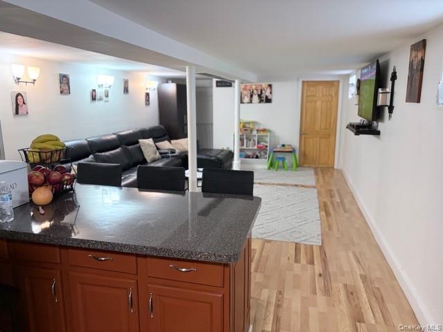78-18 65th Street Queens, NY 11385 - Photo 18 of 25 a living room with furniture and a wooden floor