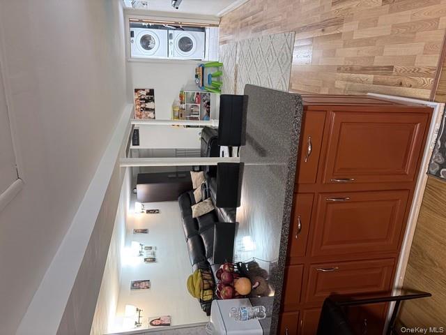 78-18 65th Street Queens, NY 11385 - Photo 19 of 25 a kitchen with granite countertop a sink and cabinets