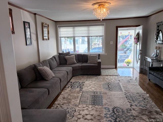 78-18 65th Street Queens, NY 11385 - Photo 5 of 25 a living room with furniture and a flat screen tv