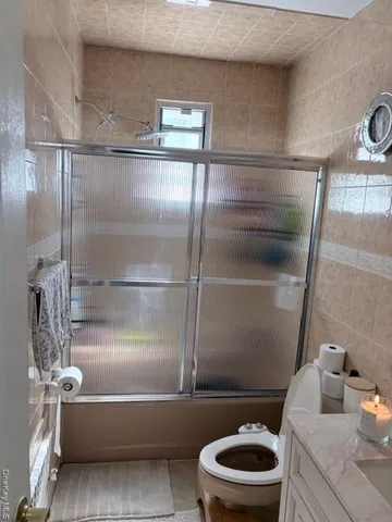 a bathroom with a toilet and a sink