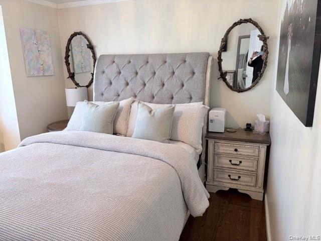 78-18 65th Street Queens, NY 11385 - Photo 9 of 25 a bedroom with a bed and a painting on the wall