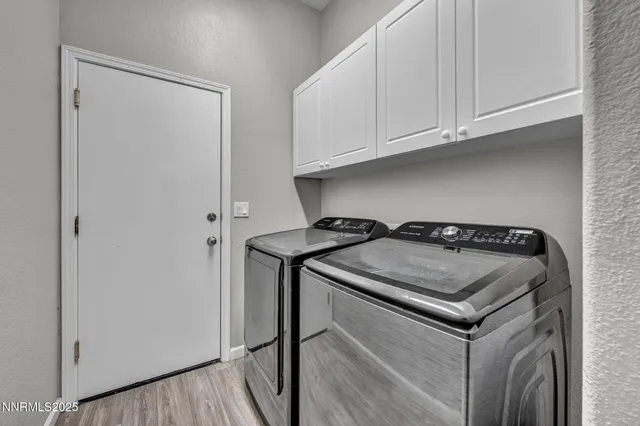 a view of a house with wooden fence