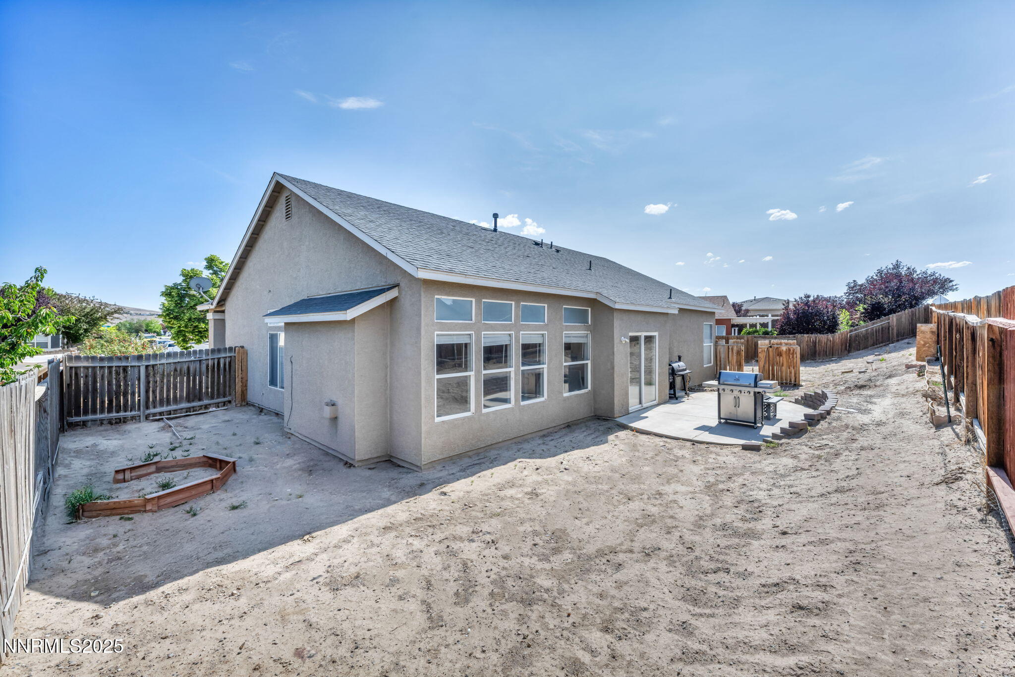 908 Jones Way Fernley, NV 89408 - Photo 16 of 17 a view of a house with backyard and sitting area