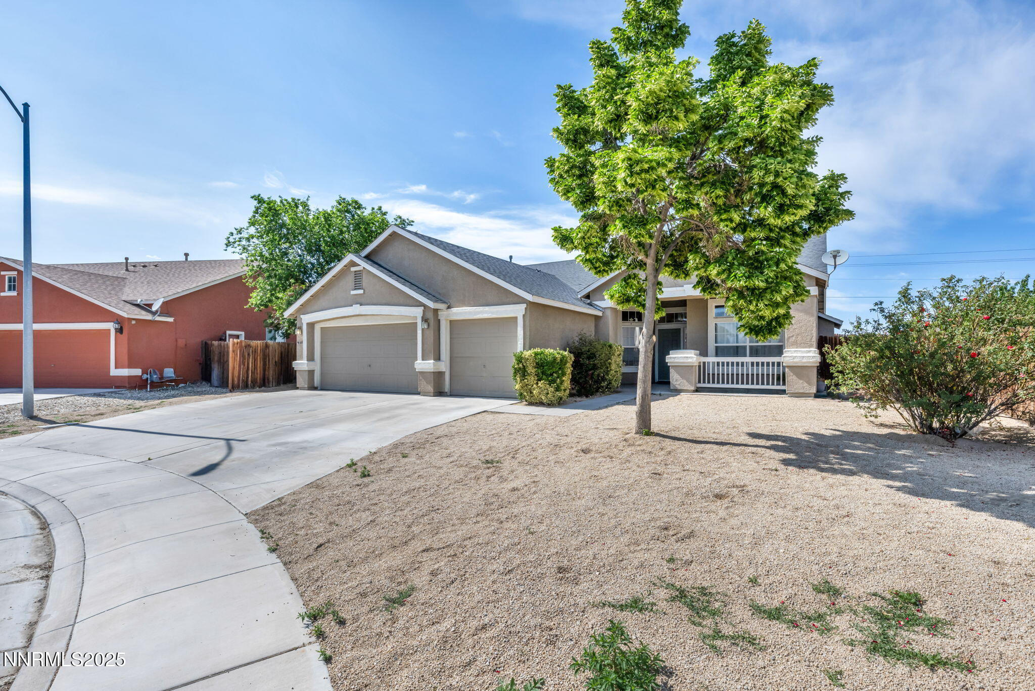 908 Jones Way Fernley, NV 89408 - Photo 17 of 17 a front view of a house with a yard and a garage