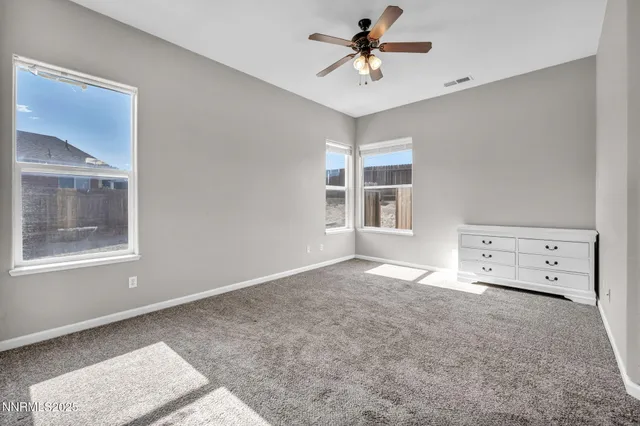 a spacious bathroom with a granite countertop sink a mirror a shower and a bathtub