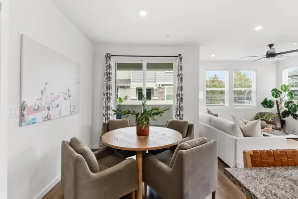 a dining room with furniture and window
