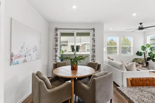 a dining room with furniture and window