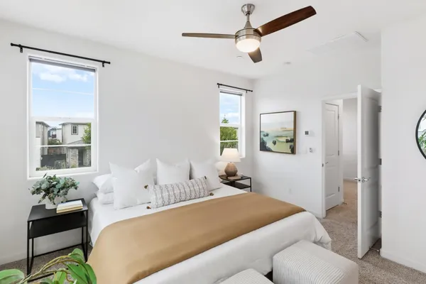 a bedroom with a bed furniture and a window