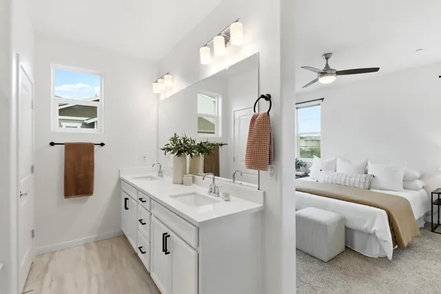a bathroom with a double vanity sink and a mirror