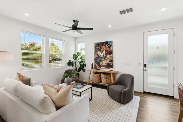 a living room with furniture and a window