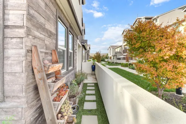 a view of a balcony with yard