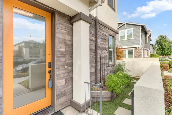 a front view of a house with a glass windows