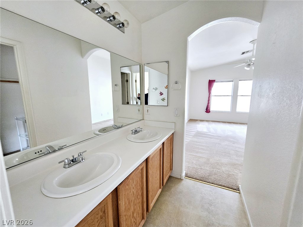 1663 Lefty Garcia Way Henderson, NV 89002 - Photo 1 of 31 Dual vanity sinks provide ample space in this practical primary bathroom.