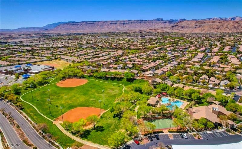10247 Splendor Ridge Avenue Las Vegas, NV 89135 - Photo 2 of 38 Aerial view of residential area featuring a mountainous background