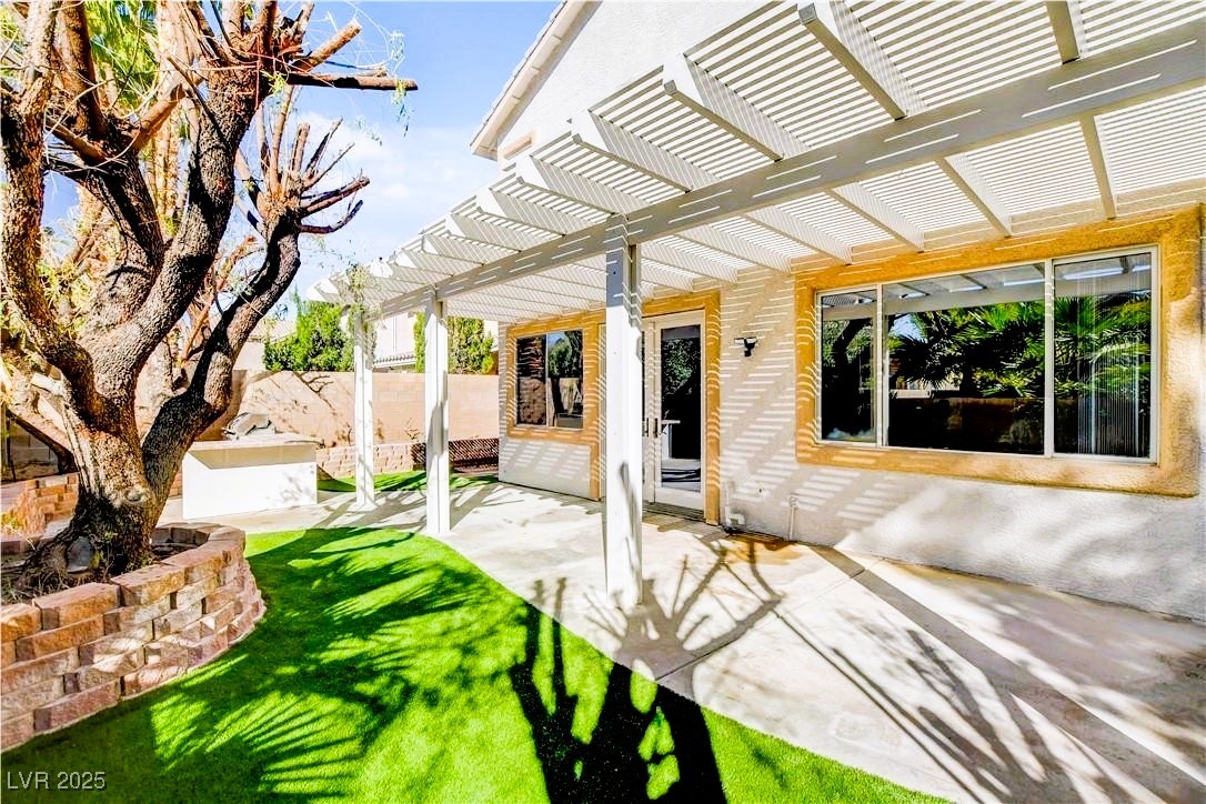 10247 Splendor Ridge Avenue Las Vegas, NV 89135 - Photo 33 of 38 View of patio with a pergola