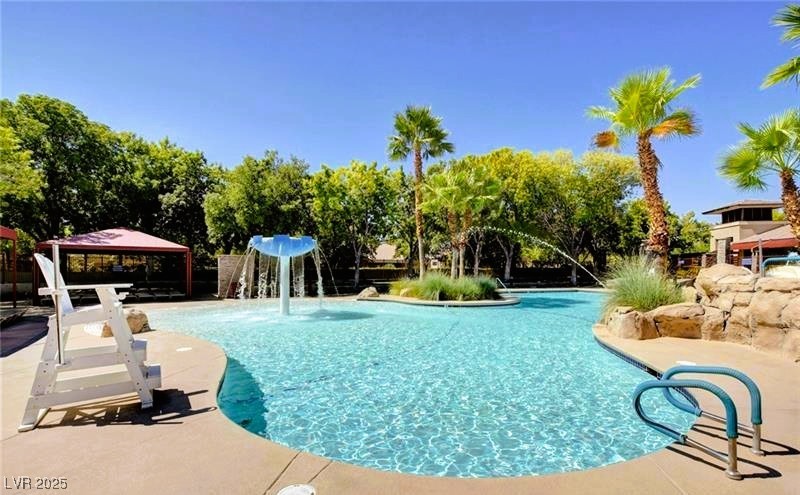 10247 Splendor Ridge Avenue Las Vegas, NV 89135 - Photo 35 of 38 Community pool with a patio area and a gazebo