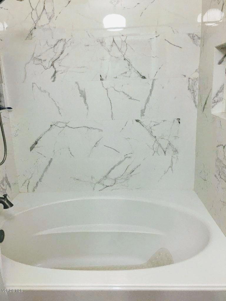 2050 North Riverside Avenue Rialto, CA 92377 - Photo 16 of 18 a bathroom with bathtub