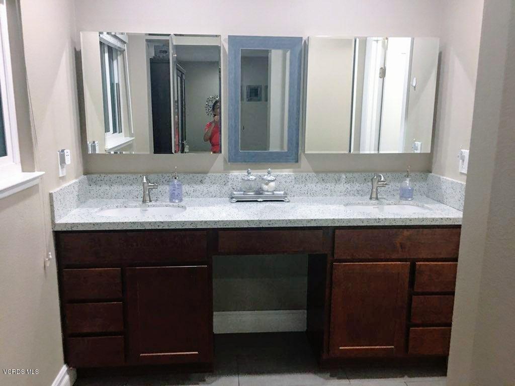 2050 North Riverside Avenue Rialto, CA 92377 - Photo 18 of 18 a bathroom with a sink and a mirror