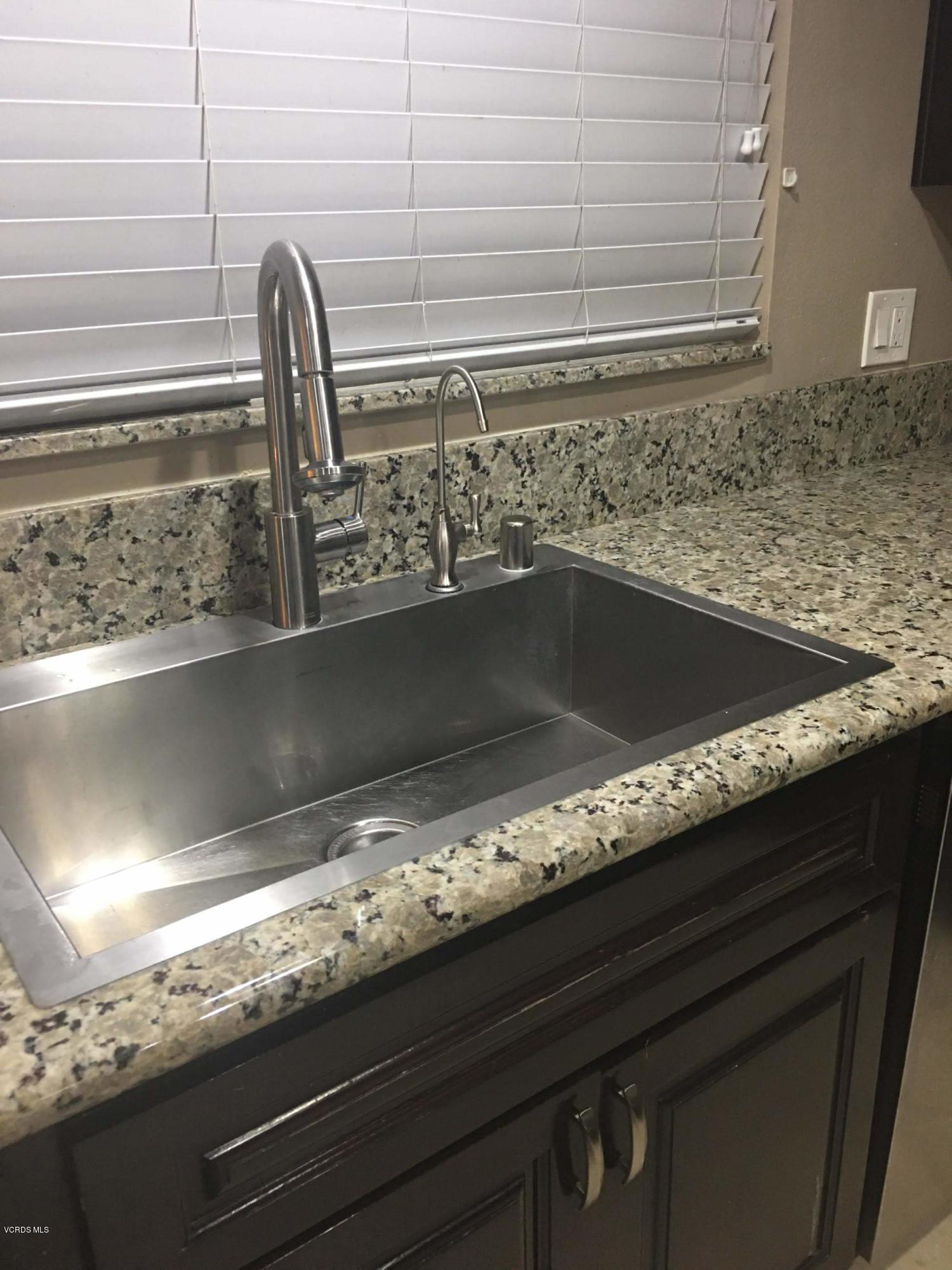 2050 North Riverside Avenue Rialto, CA 92377 - Photo 6 of 18 a close view of sink and tap