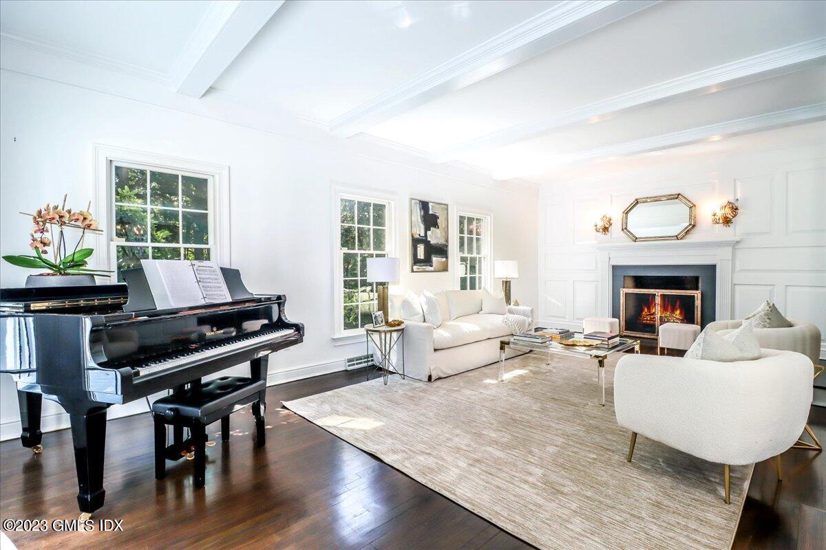 62 North Old Stone Bridge Road Cos Cob, CT 06807 - Photo 13 of 32 a living room with furniture a fireplace and a large window