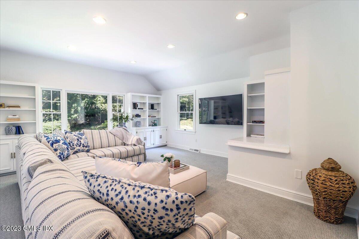 62 North Old Stone Bridge Road Cos Cob, CT 06807 - Photo 18 of 32 a living room with furniture ceiling fan and a rug