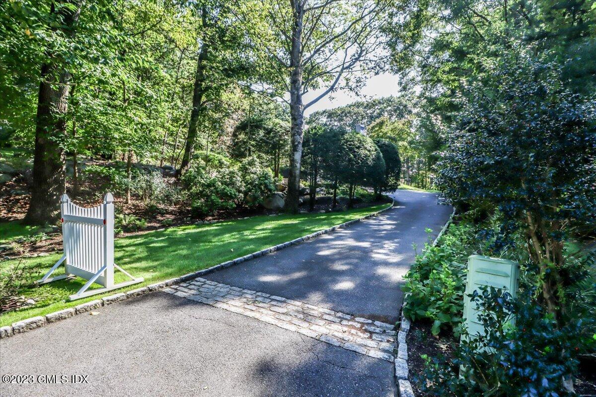 62 North Old Stone Bridge Road Cos Cob, CT 06807 - Photo 2 of 32 a view of a street with a yard and a trees