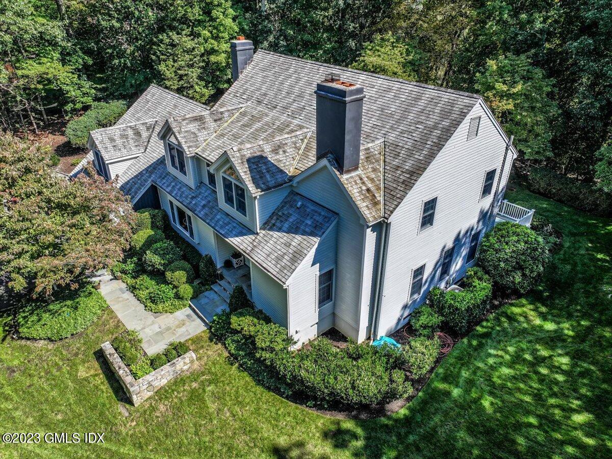62 North Old Stone Bridge Road Cos Cob, CT 06807 - Photo 27 of 32 an aerial view of a house with balcony and trees