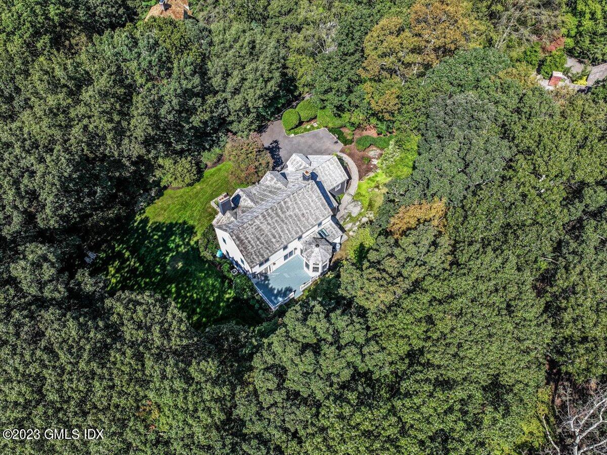 62 North Old Stone Bridge Road Cos Cob, CT 06807 - Photo 29 of 32 a view of a house with a yard and a tree