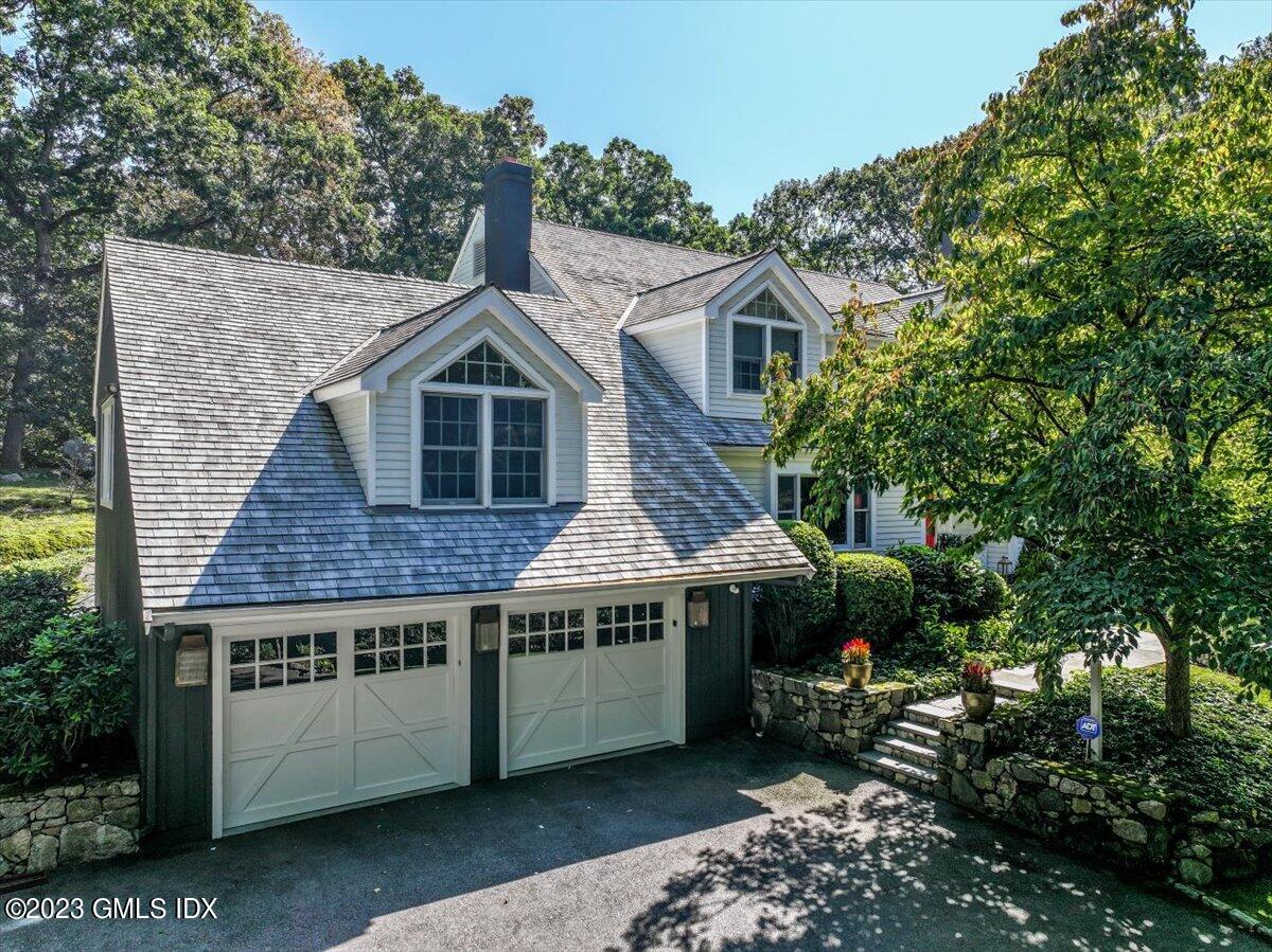 62 North Old Stone Bridge Road Cos Cob, CT 06807 - Photo 4 of 32 a view of a house with a yard and potted plants