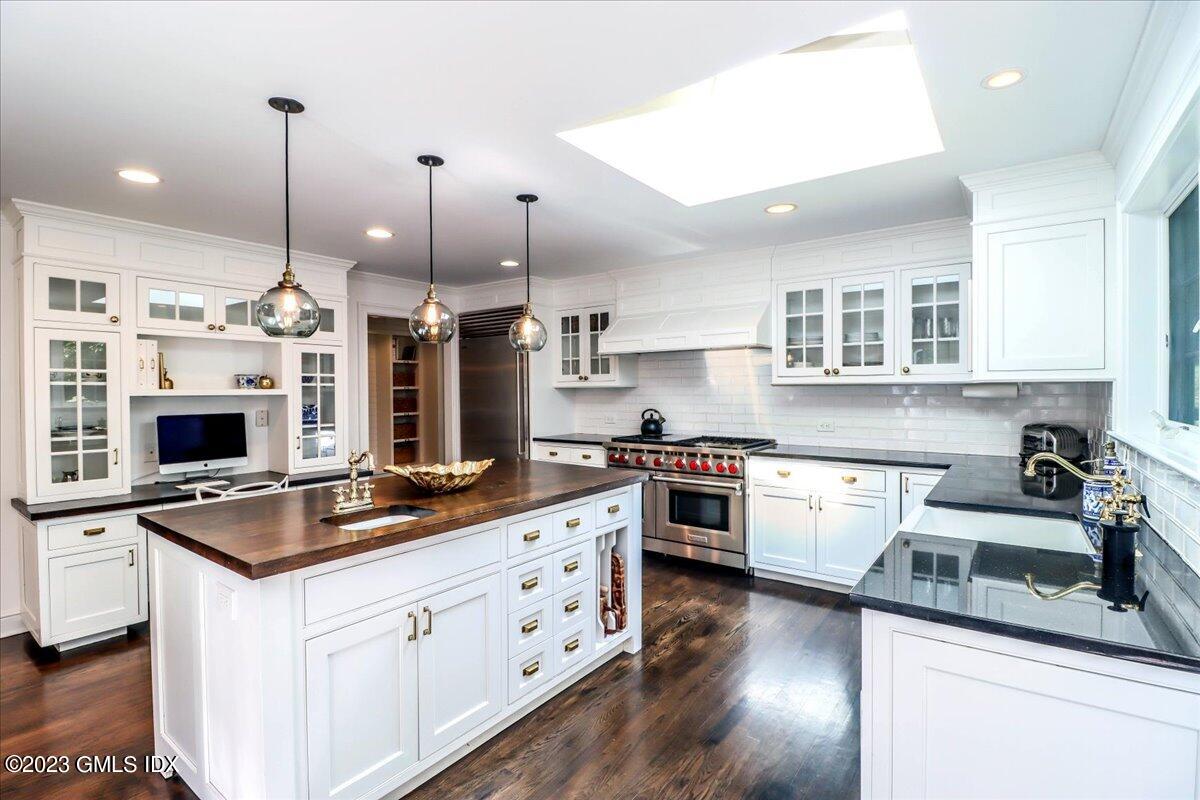 62 North Old Stone Bridge Road Cos Cob, CT 06807 - Photo 7 of 32 a kitchen with stainless steel appliances granite countertop a sink stove and refrigerator