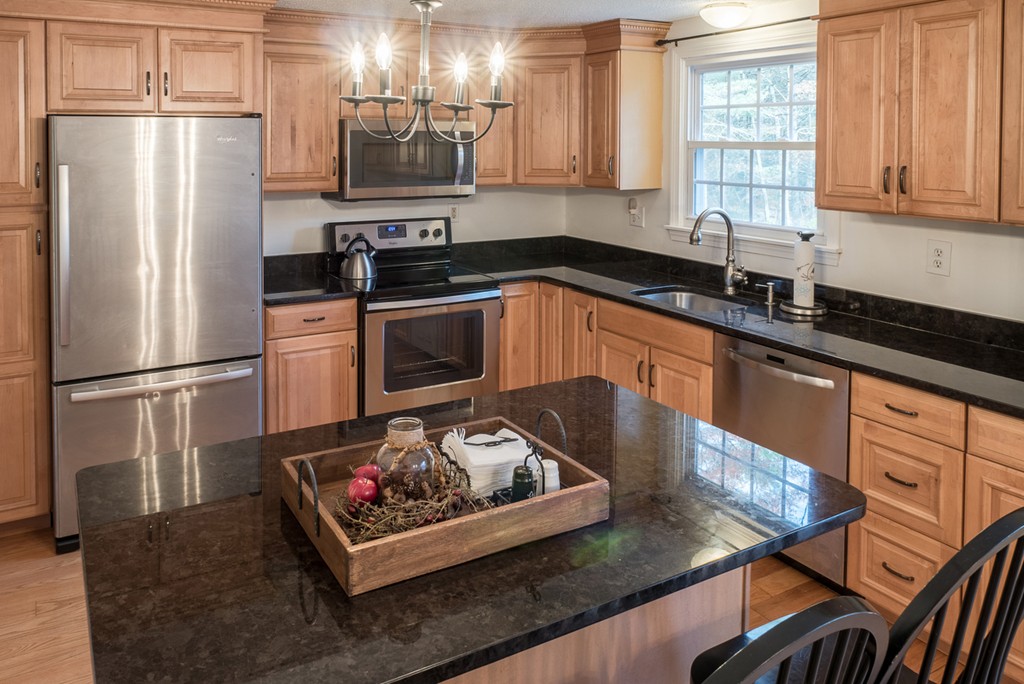 20 Bay Road Easton, MA 02356 - Photo 3 of 7 a kitchen with stainless steel appliances granite countertop a sink stove and refrigerator