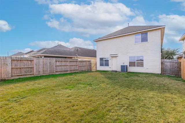 a view of a backyard of the house