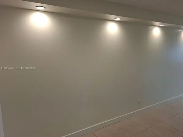 a kitchen with a refrigerator a stove and cabinets
