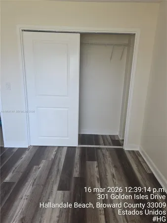 a kitchen with stainless steel appliances granite countertop a refrigerator and a stove