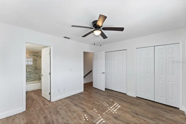 a view of an entryway with wooden floor