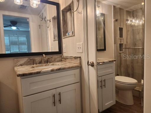 802 Hidden Harbour Drive Indian Rocks Beach, FL 33785 - Photo 20 of 31 a bathroom with a granite countertop sink toilet and shower