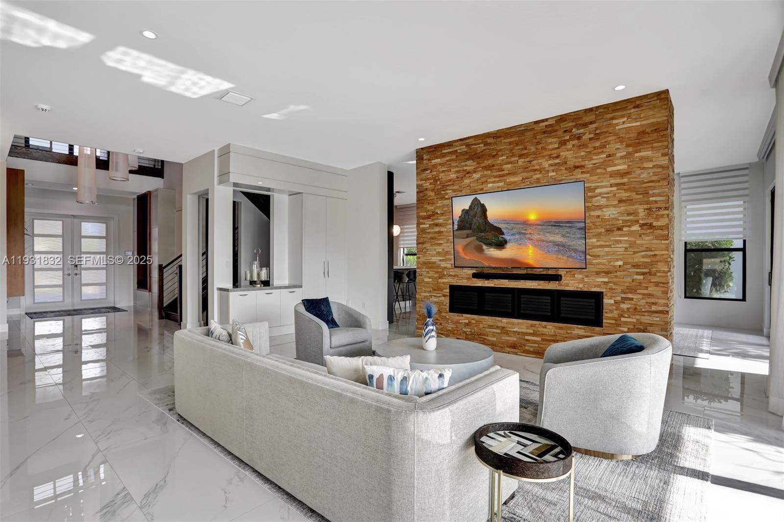 17113 Aquavera Way Boca Raton, FL 33496 - Photo 12 of 84 a living room with fireplace furniture and a flat screen tv