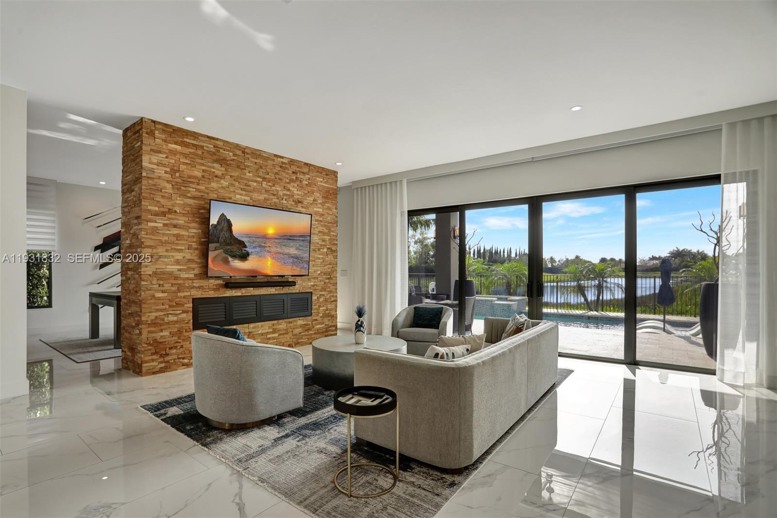 17113 Aquavera Way Boca Raton, FL 33496 - Photo 13 of 84 a living room with furniture a large window with outer view
