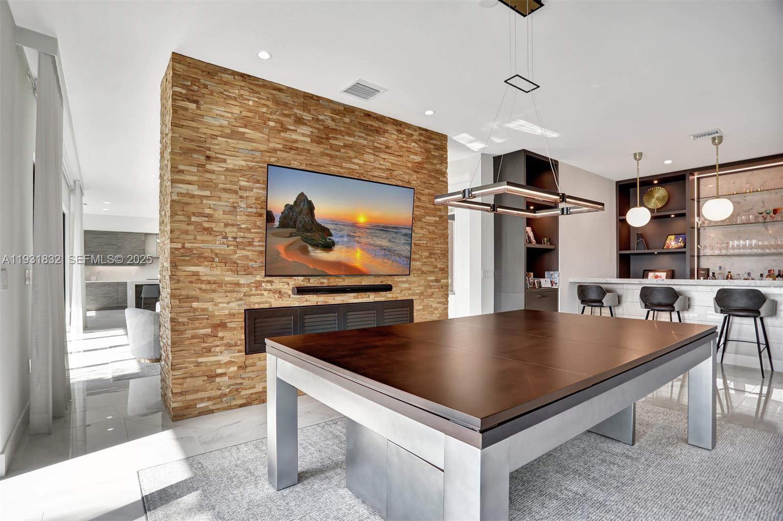 17113 Aquavera Way Boca Raton, FL 33496 - Photo 18 of 84 a kitchen with stainless steel appliances granite countertop a sink table and chairs