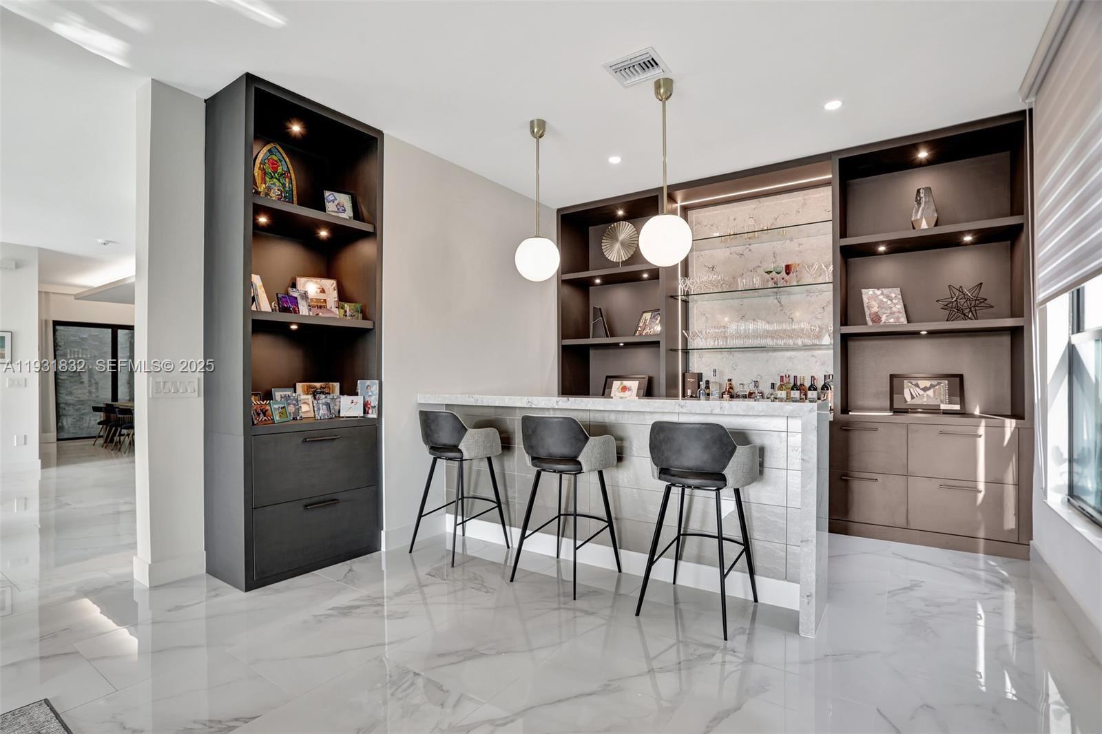 17113 Aquavera Way Boca Raton, FL 33496 - Photo 19 of 84 a kitchen with stainless steel appliances kitchen island granite countertop a refrigerator and a sink