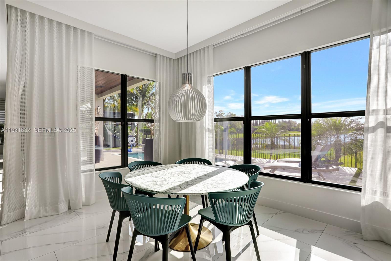 17113 Aquavera Way Boca Raton, FL 33496 - Photo 27 of 84 a view of a dining room with furniture and window