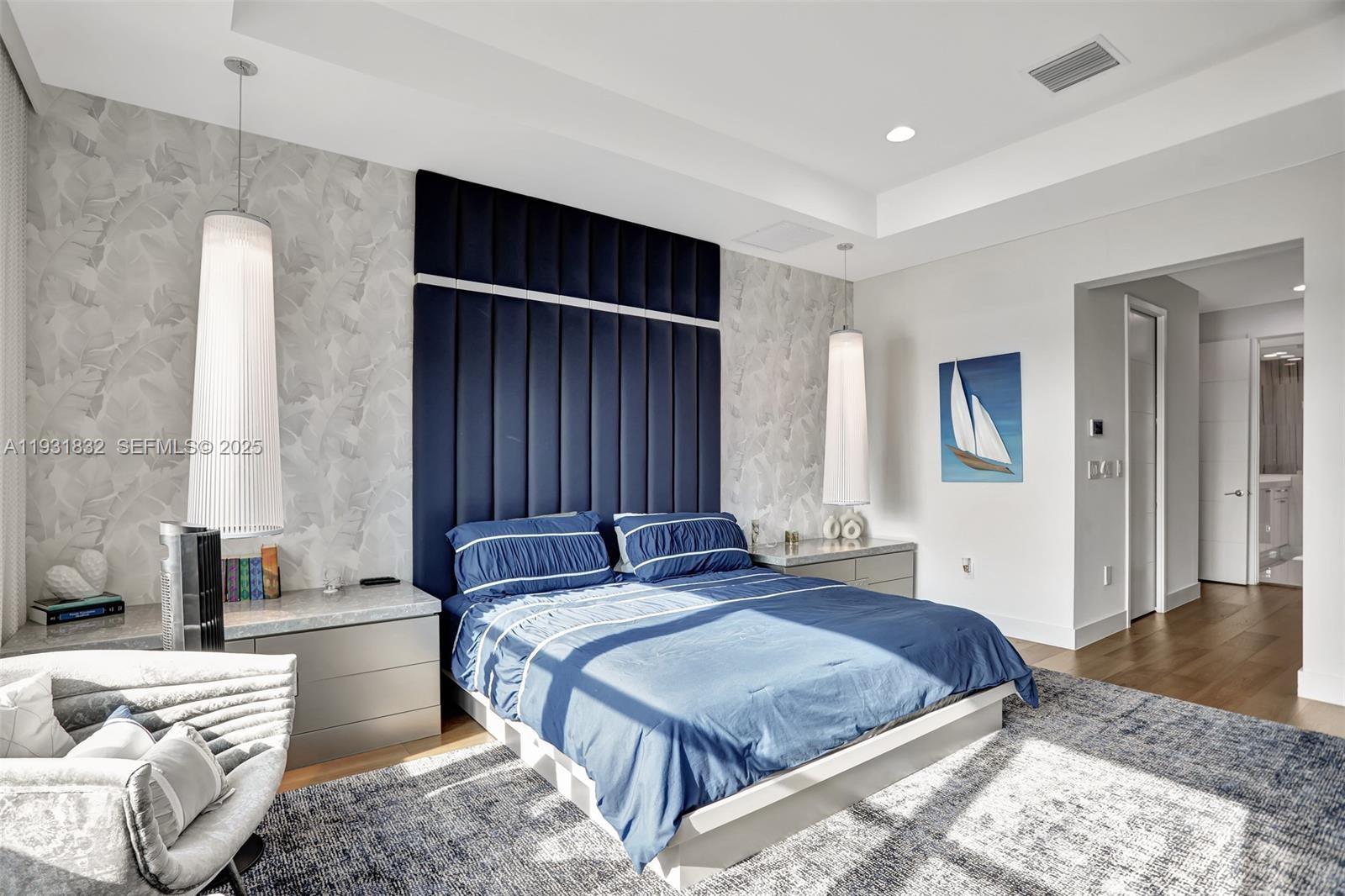 17113 Aquavera Way Boca Raton, FL 33496 - Photo 41 of 84 a bedroom with a bed and wooden floor