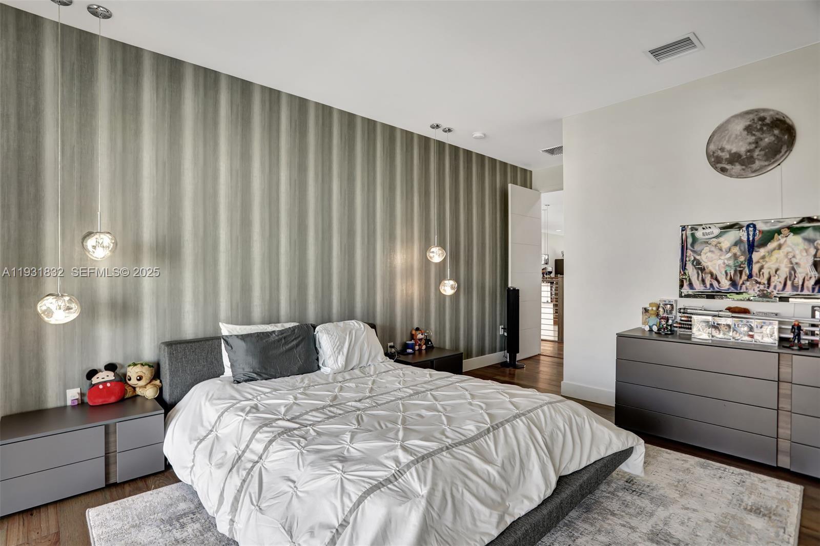 17113 Aquavera Way Boca Raton, FL 33496 - Photo 47 of 84 a bedroom with a bed and a table