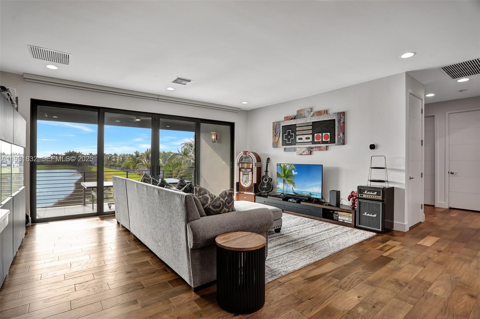 17113 Aquavera Way Boca Raton, FL 33496 - Photo 56 of 84 a living room with furniture and a large window