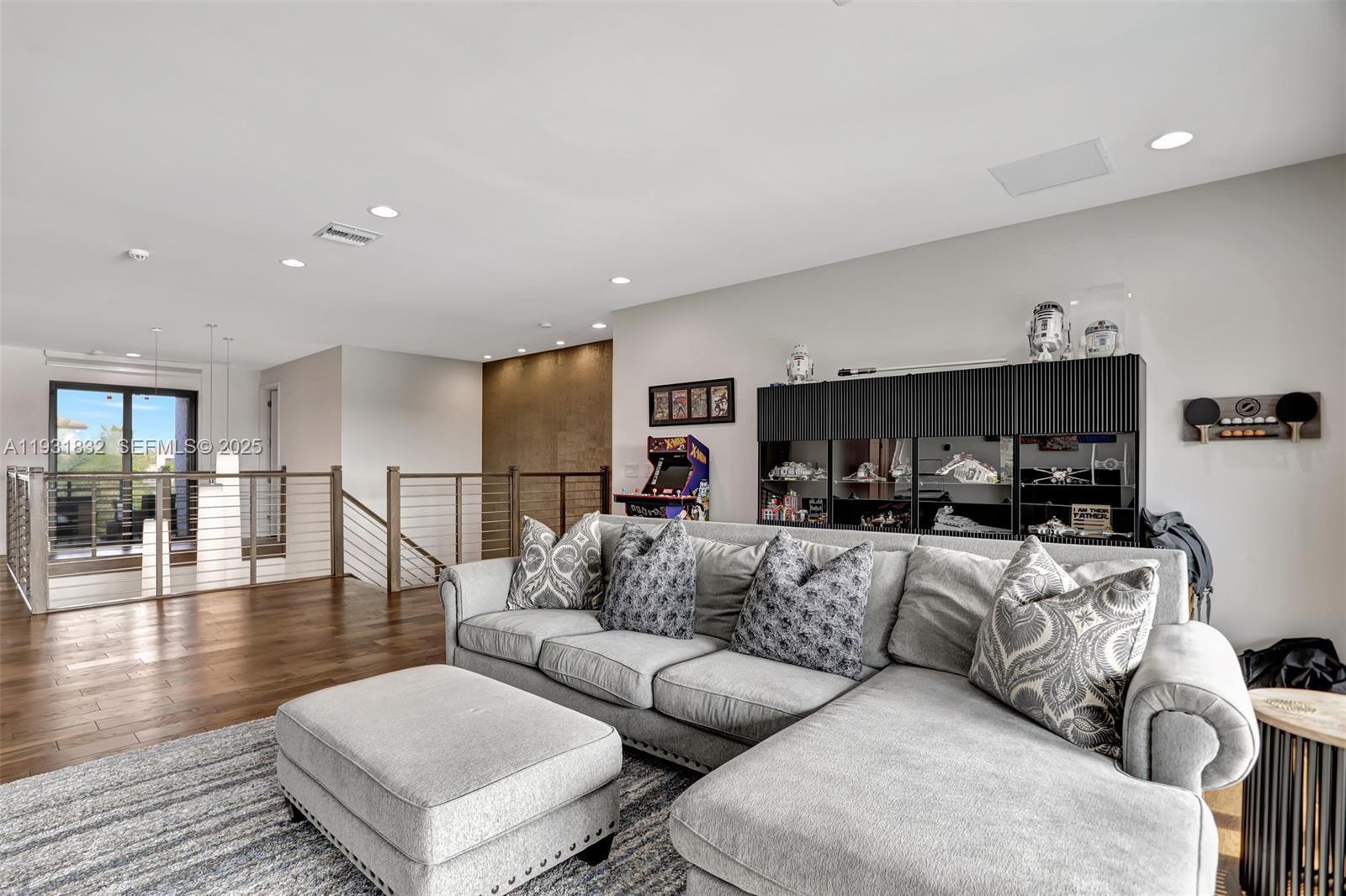 17113 Aquavera Way Boca Raton, FL 33496 - Photo 61 of 84 a living room with furniture and a flat screen tv