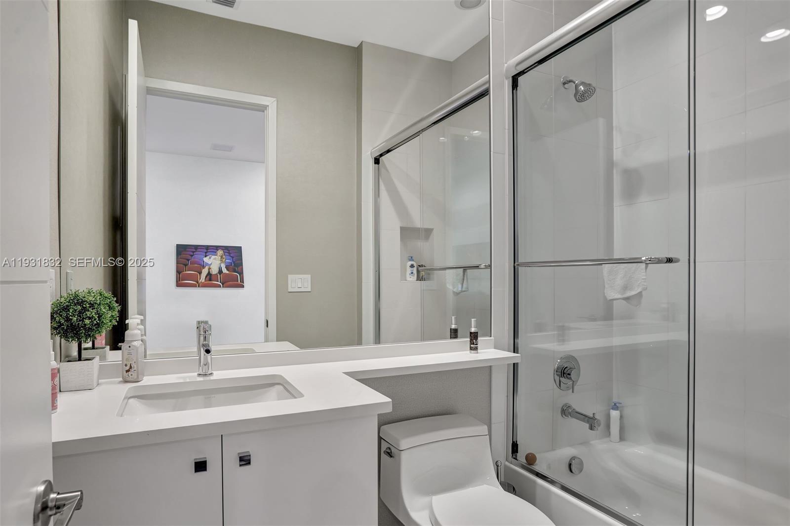17113 Aquavera Way Boca Raton, FL 33496 - Photo 62 of 84 a bathroom with a sink toilet and shower